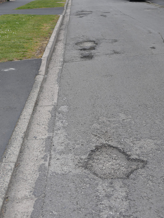 27 A religious street, rather holey